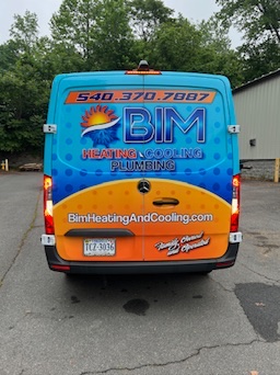 Rear vehicle wrap designed and installed by a local print shop for BIM’s service fleet branding.