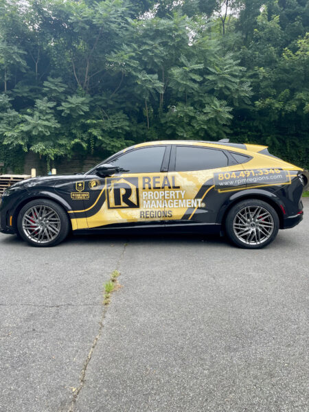 An alternative side view of a wrapped car for Real Property Management Regions, a vehicle wraps client of Core Prints in Fredericksburg, VA.